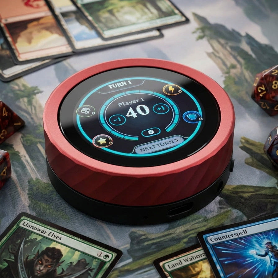 Round Life Tracker device with digital display on a fantasy-themed board game