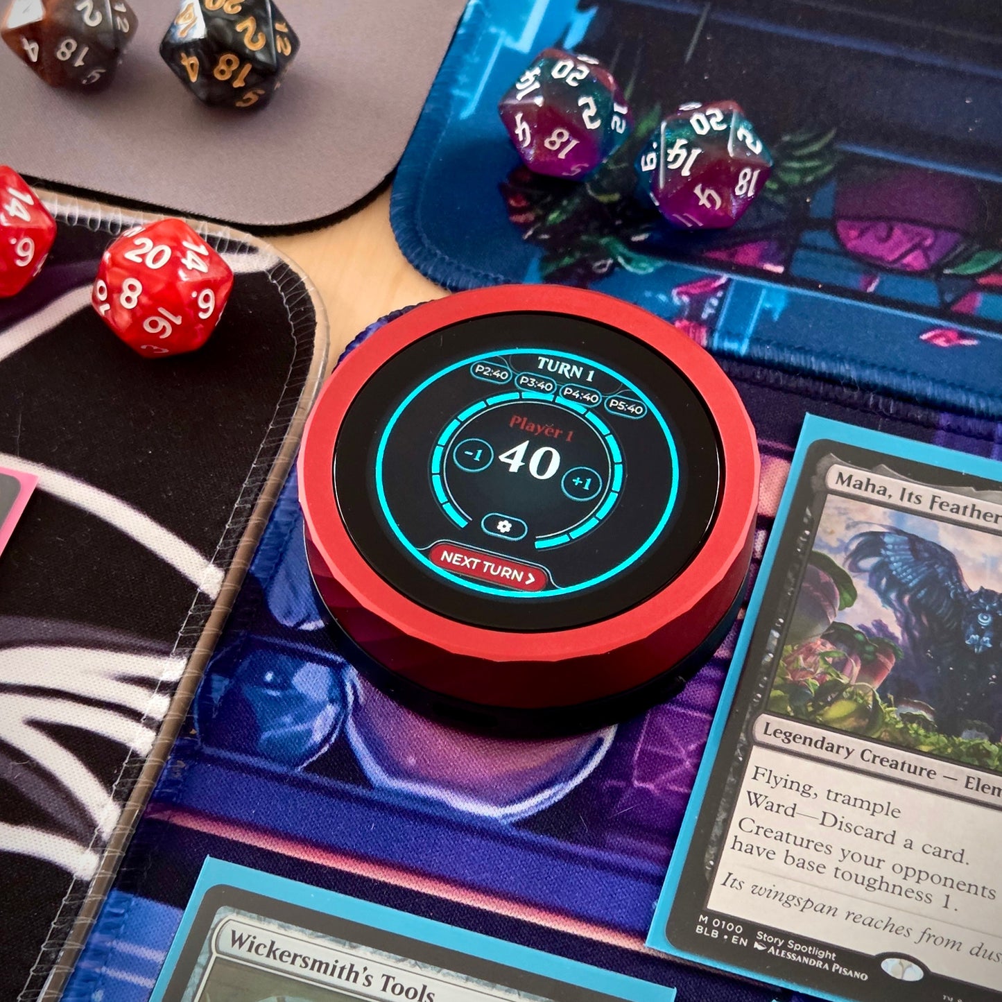 Digital device displaying game scores on a tabletop gaming setup with cards and dice.