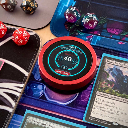 Digital device displaying game scores on a tabletop gaming setup with cards and dice.