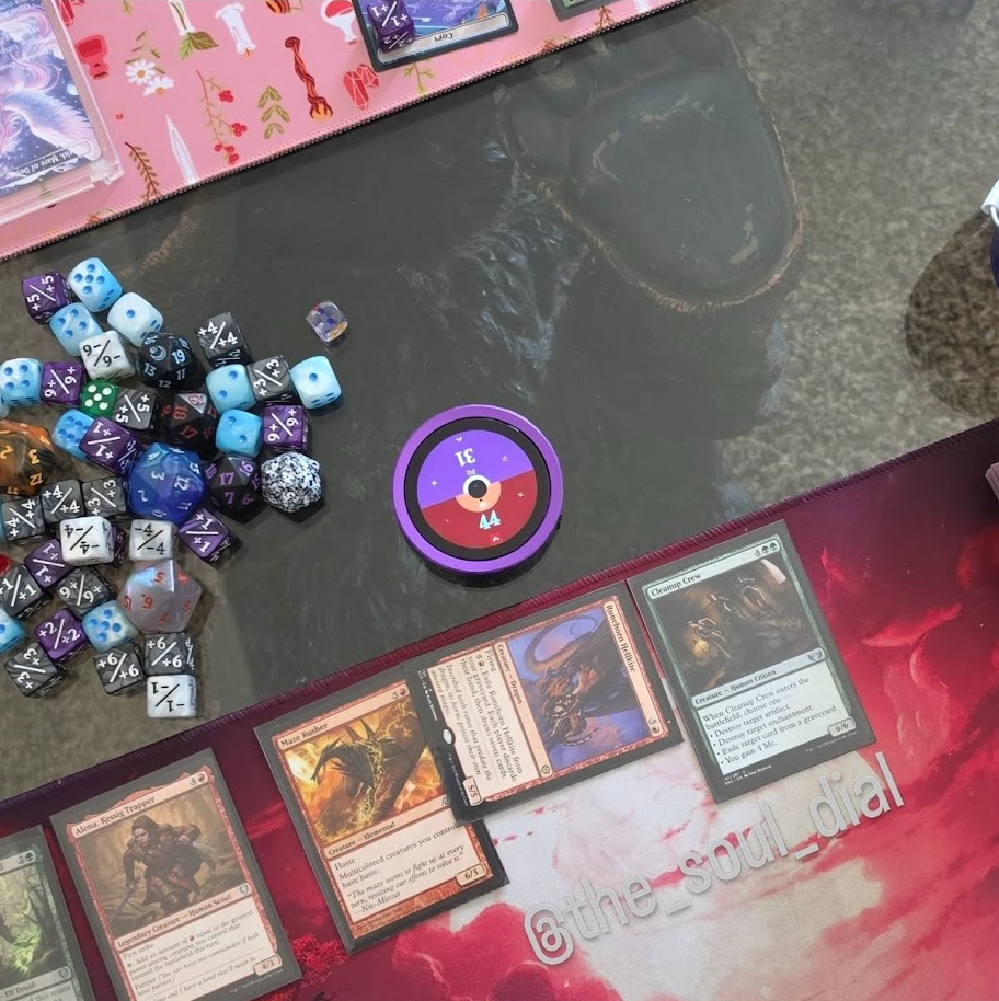 Purple Soul Dial tracking two life totals between playmats