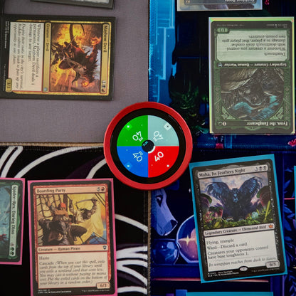 Collection of trading cards on a surface with a colorful TCG Digital Life Counter in the center.